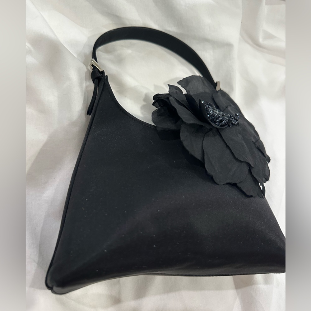 Elegant Black Handbag featuring a gorgeous Rosette embellishment